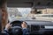 Selective focus of man hands on steering wheel driving a car on the speed highway. View from above. Moscow. Russia.