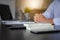 Selective focus of Money banknotes on the table with blurred young business muslim man background, Arab finance concept