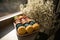 selective focus on multicolored delicious macarons on plate on blurred background