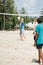 selective focus of multiethnic old men playing volleyball together