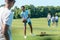 selective focus of multiethnic teenage friends playing with rugby ball