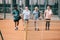 selective focus of multiracial elderly friends with tennis equipment