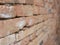 Selective focus of old grungy handmade brick wall