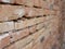 Selective focus of old grungy handmade brick wall
