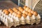 Selective focus on one of egg rows, food background, Fresh eggs in a cardboard panel