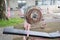 Selective focus and perspective view of old, grunge and rusty barbell equipment in the public outdoor gym which is free of charge