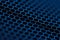 Selective focus photo. Close up picture of geometrical neon blue hexagon background