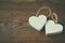 Selective focus photo of couple of wooden hearts on rustic table. valentine\'s day celebration concept.