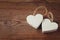 Selective focus photo of couple of wooden hearts on rustic table. valentine\'s day celebration concept.