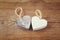 Selective focus photo of couple of wooden hearts on rustic table. valentine\'s day celebration concept.