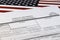 Selective focus photo of i-130 form. petition for alien relative, on a background of United States flag