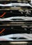 Selective focus photo only metal cooler in focus, row of video graphics cards on computing rig. Abstract cryptocurrency mining