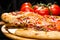 Selective focus on piece of appetizing Italian pizza with meat,