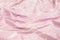 Selective focus of pink textile background. Textured shiny retro decoration design