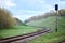 Selective focus railway lantern of semaphore railroad enable, allow permit track that twists and turns between hills