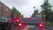 Selective focus on raindrops on the windshield of a car standing in a traffic jam on a city street.