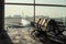 Selective focus on a row of vacancy chairs at the departure terminal at the airport with parking airplane in background