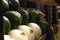 Selective focus shot of avocados and white onions with a male background