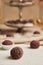 Selective focus shot of a Brazilian Brigadeiro on the background of served choco balls