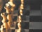 Selective-focus shot of the chess king golden figure on a chessboard