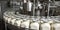 A selective focus shot of complete milk bottling line in a factory. Generative AI