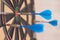 Selective focus shot of a dartboard with arrows