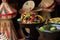 Selective focus shot of delicious Ethiopian food with fresh vegetables on a wooden table