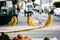 Selective focus shot of hanging bananas in a glass display