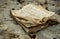 Selective focus shot of an old book on a rocky surface