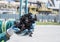 Selective focus shot of a person wearing gloves holding shredded tires