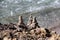 Selective focus shot of sandy pyramids near the beach