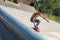 Selective focus shot of a skateboarder doing tricks on his skateboard during a sunny day