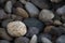 Selective focus shot of various pebbles