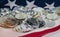 IN selective focus of silver bitcoin put on group of blurred bitcoin,warm light tone,put on USA flag