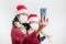 Selective focus smart phone video call on christmas coronavirus