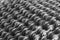 A selective focus of stack of stainless steel motorcycles chain in a black and white. Use as a background