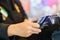 Selective focus to the cashier is swiping the credit card or member card at the card reader with the cash register machine in the