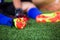 Selective focus to goalkeeper is sitting and catch the soles of the feet because of pain, soccer player was injured in the foot