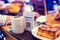 Selective focus to QR code payment tag with blur bread set meal and coffee in coffee shop or restaurant to accepted generate