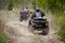 Selective focus. Two riders on ATVs ride on a dirt road. The concept of outdoor activities and extreme sports