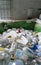 Selective focus view of large recycling bin filled with many different size and color light bulbs