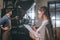 selective focus of woman checking colleagues work during coffee