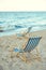 selective focus of wooden beach chairs on sandy beach with sea