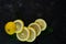 selective focus, yellow lemon rings on dark background