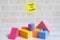 Selective focus of yellow sticky notes written with & x27;TIME TO LEARN& x27; with colorful soft building blocks. Education theme