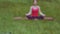 Selective focus. Yoga instructor girl performing meditation breathing technique doing exercises outdoors in the park or