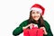 Selective focus Young beautiful asian woman wore green sweater and santa hat,Excited, surprised and happy, Holding a gift box with