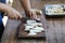 Selective focus of Young man cutting milky-mushroom and cooking in kitchen table