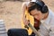 Selective focus of young relaxed man is playing acoustic guitar in outdoor.