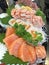 Selective focused on Japanese food cuisine gourmet: platter of sashimi fresh raw fish meat including salmon, fatty salmon, scall